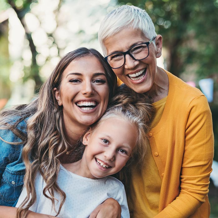 three generations of woman laughing together